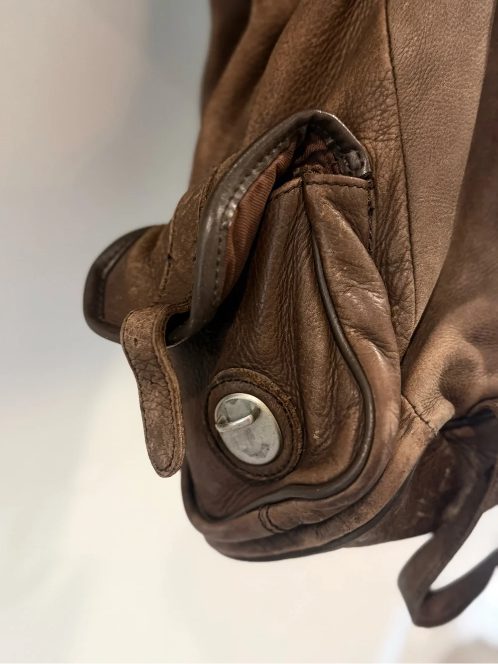 Men's Brown Leather Backpack with Front and Side Pockets